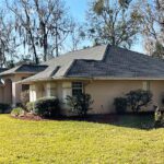 An Exterior Section of a House With a Gray Color Roofing